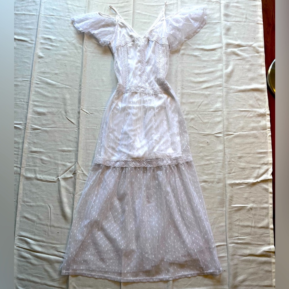 DISNEY COLLECTION. White mini dress with see through lace on top.